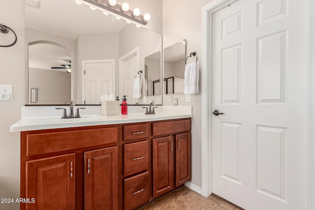 bathroom featuring ceiling fan, tile patterned floors, and vanity