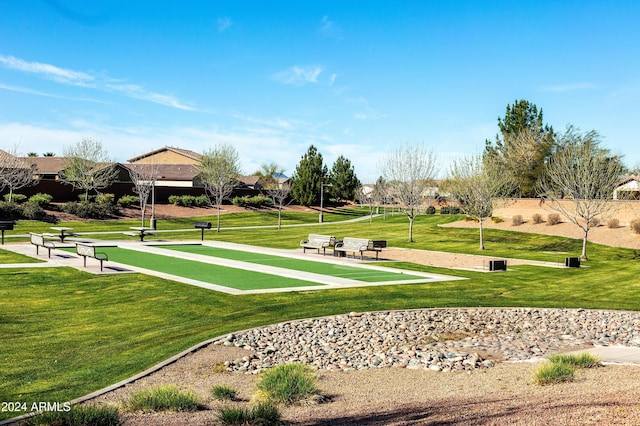 view of property's community with a yard