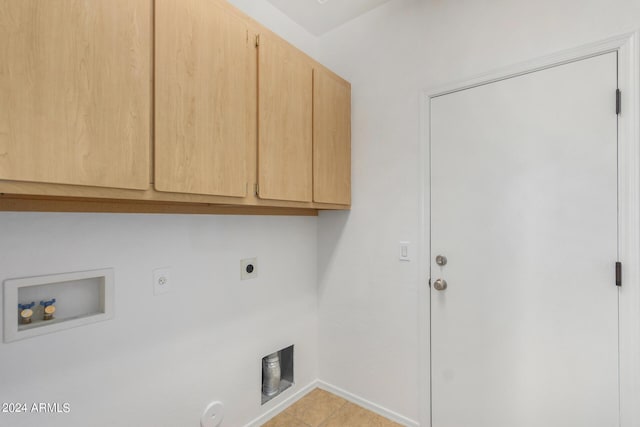 laundry room featuring cabinet space, baseboards, hookup for a gas dryer, hookup for a washing machine, and electric dryer hookup