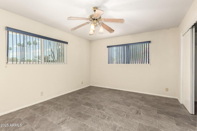 unfurnished bedroom featuring baseboards and a ceiling fan
