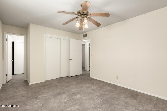 unfurnished bedroom featuring a closet, baseboards, and a ceiling fan