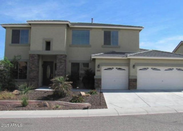 6619 W Cordia Ln, Phoenix, AZ 85083 - view of front of property with stucco siding, concrete driveway, a garage, and stone siding