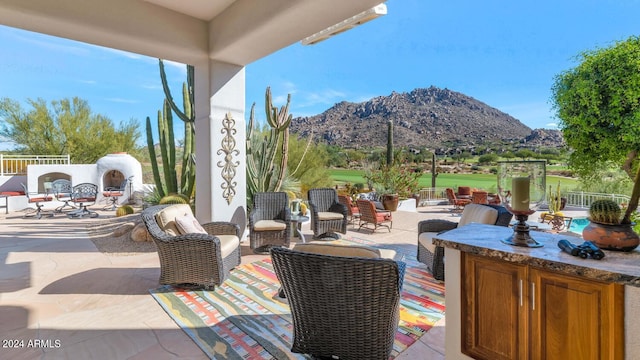 view of patio / terrace with a mountain view