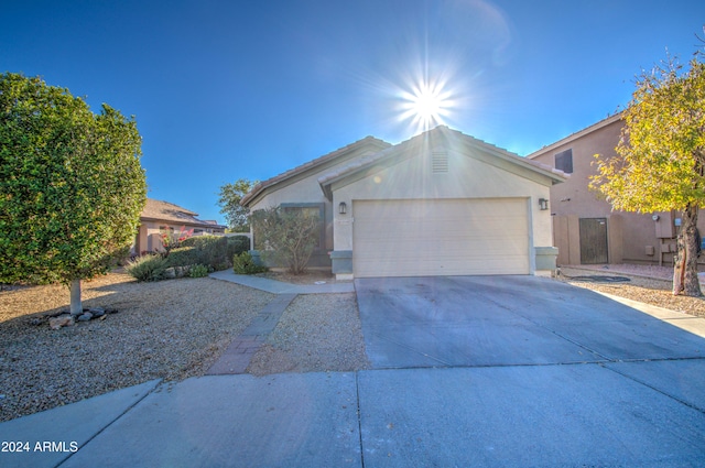 single story home with a garage