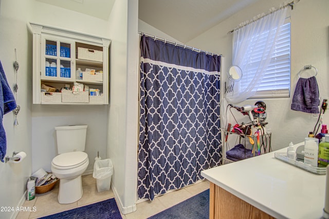 bathroom featuring a shower with curtain, tile patterned flooring, lofted ceiling, toilet, and vanity