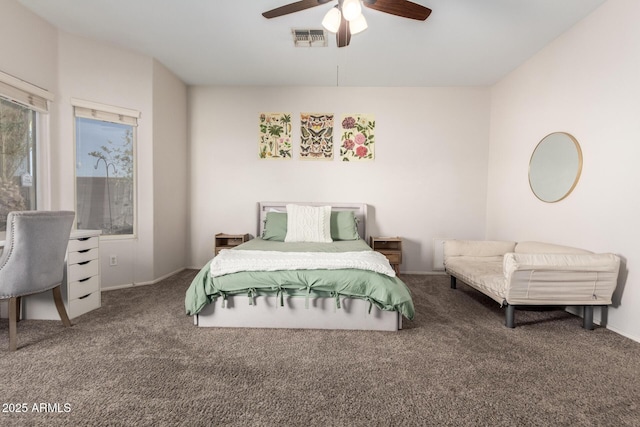 carpeted bedroom with visible vents and a ceiling fan