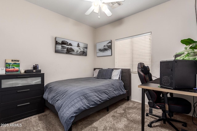 bedroom with carpet floors, baseboards, visible vents, and a ceiling fan