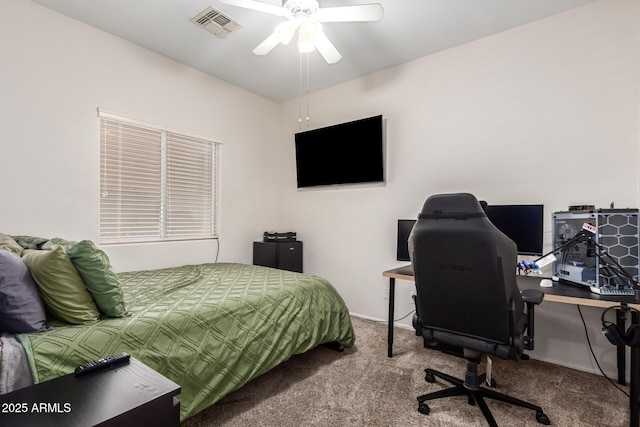 bedroom featuring a ceiling fan, visible vents, and carpet flooring