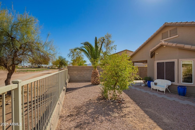 view of yard with a fenced backyard