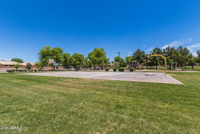 view of home's community featuring playground community, a lawn, and community basketball court