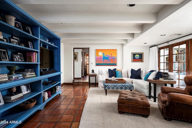 sitting room featuring dark tile patterned flooring, french doors, and beamed ceiling