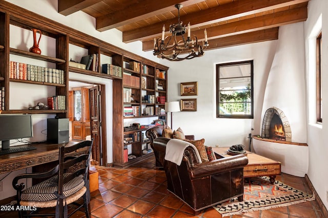 office area with dark tile patterned floors, a notable chandelier, beamed ceiling, and wooden ceiling