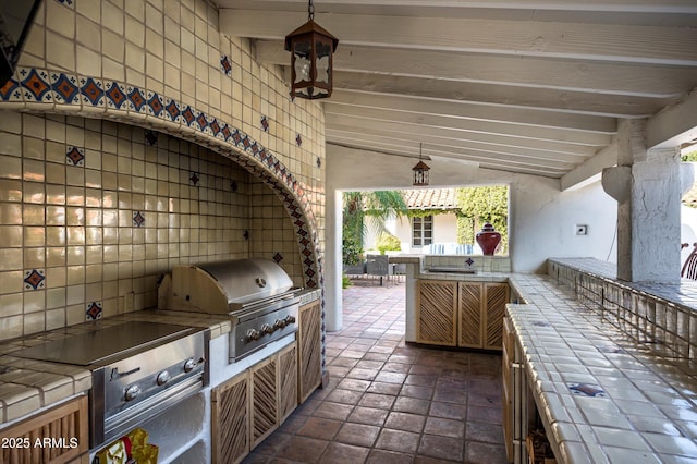 view of patio / terrace with exterior kitchen and grilling area