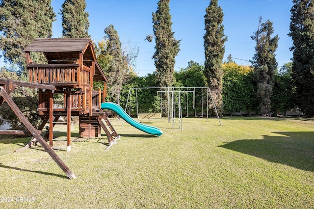 view of playground with a lawn