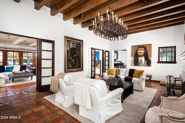 tiled living room featuring an inviting chandelier, french doors, and beamed ceiling