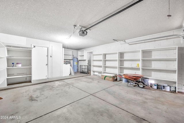 garage with water heater and a garage door opener