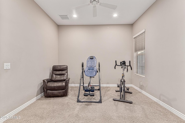 exercise area featuring carpet flooring and ceiling fan