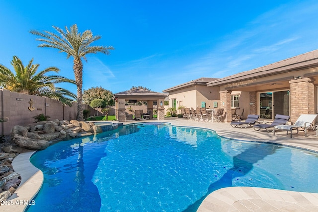 view of pool featuring a patio