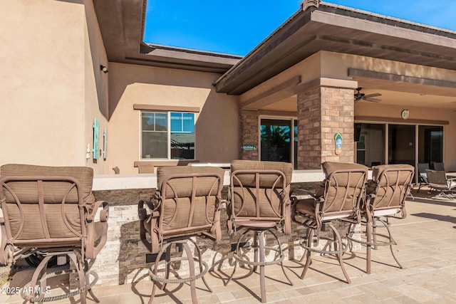 view of patio / terrace with ceiling fan