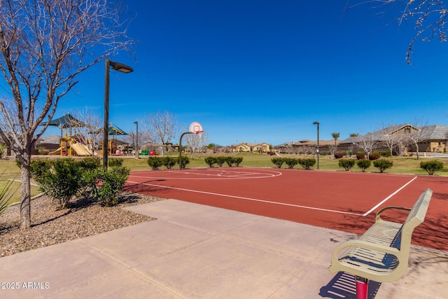 view of sport court featuring a playground