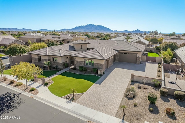 birds eye view of property with a mountain view