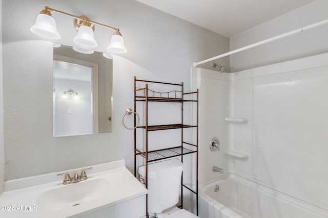 bathroom with bathing tub / shower combination, vanity, and toilet