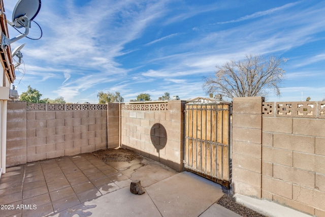 view of patio / terrace with fence and a gate