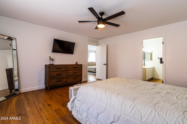 bedroom featuring dark wood-type flooring, connected bathroom, and ceiling fan