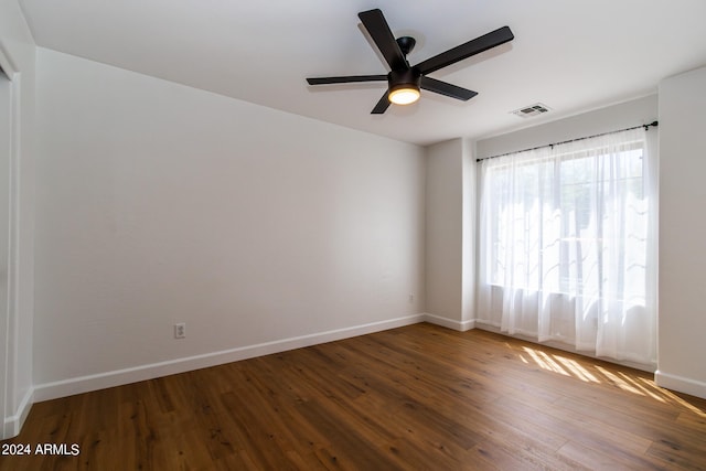 spare room featuring hardwood / wood-style floors and ceiling fan