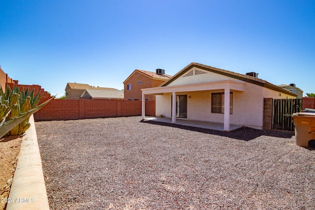 back of property with a patio area