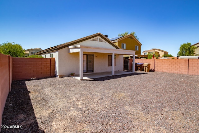 rear view of house featuring a patio