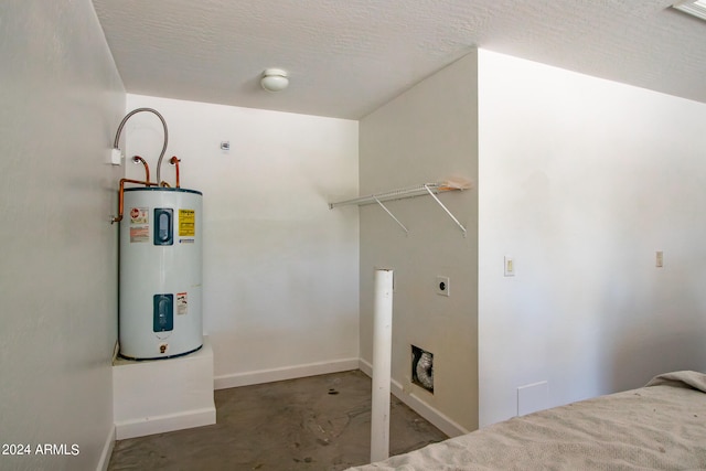 washroom with a textured ceiling and electric water heater