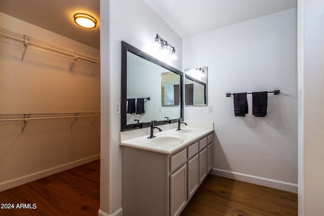 bathroom with wood-type flooring and vanity