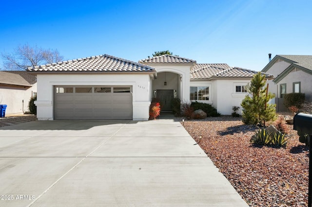 mediterranean / spanish home featuring a garage