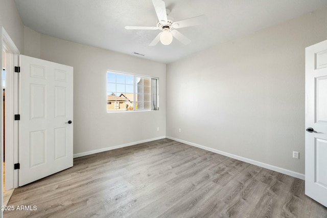 unfurnished bedroom with light hardwood / wood-style flooring and ceiling fan