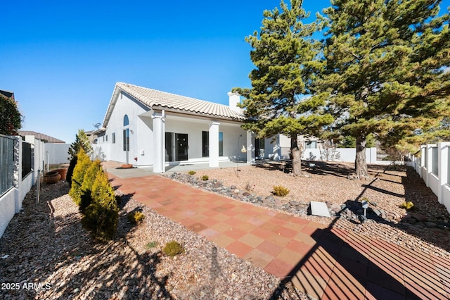 back of property with a patio area