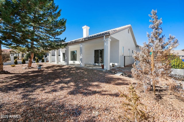 rear view of property with a patio