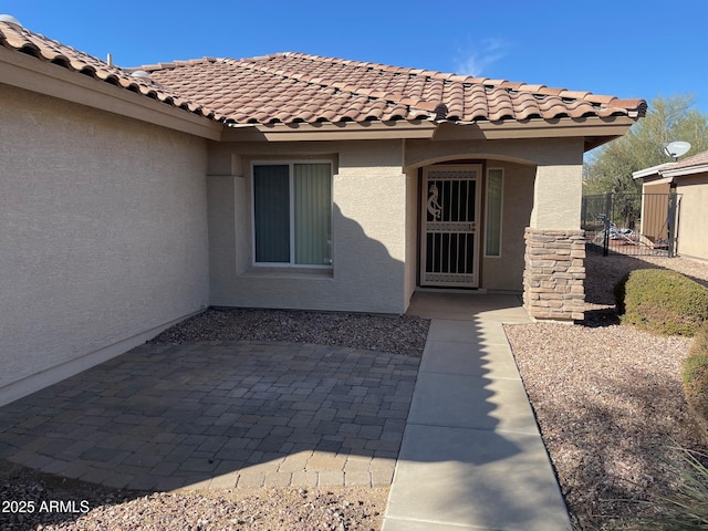 property entrance with a patio