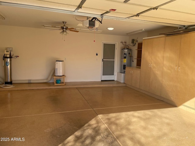 garage featuring ceiling fan, electric water heater, and a garage door opener