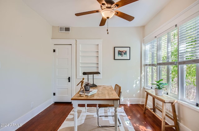 home office with baseboards, wood finished floors, and ceiling fan