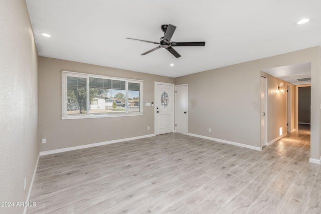 interior space with light hardwood / wood-style flooring and ceiling fan