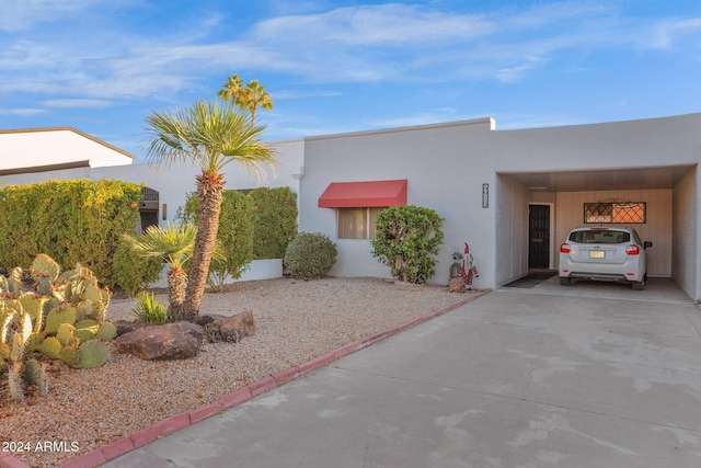 view of front of home with a carport