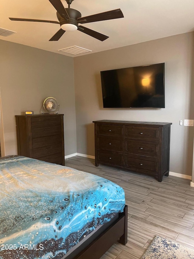 3211 W Pollack St, Phoenix, AZ 85041 - bedroom featuring baseboards, light wood finished floors, and a ceiling fan