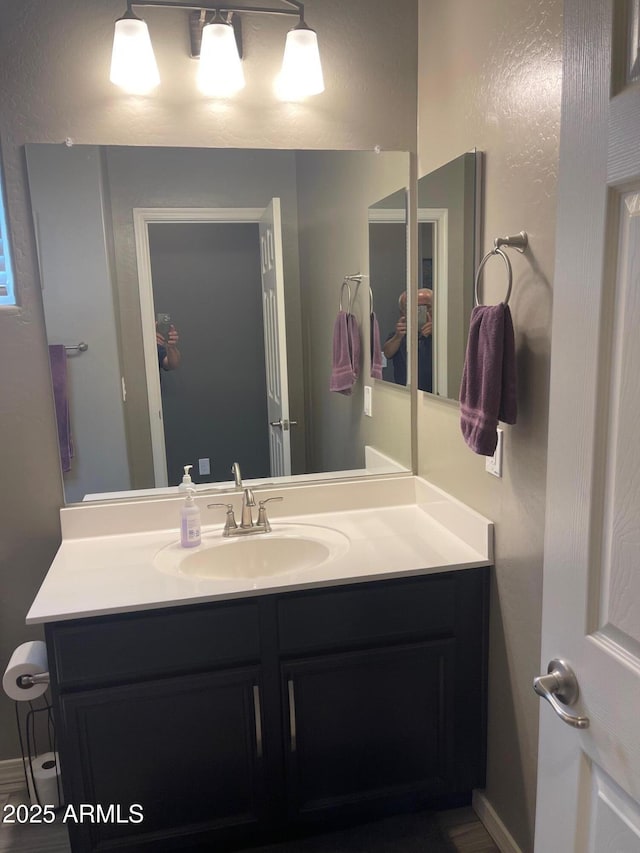 3211 W Pollack St, Phoenix, AZ 85041 - bathroom featuring vanity and baseboards