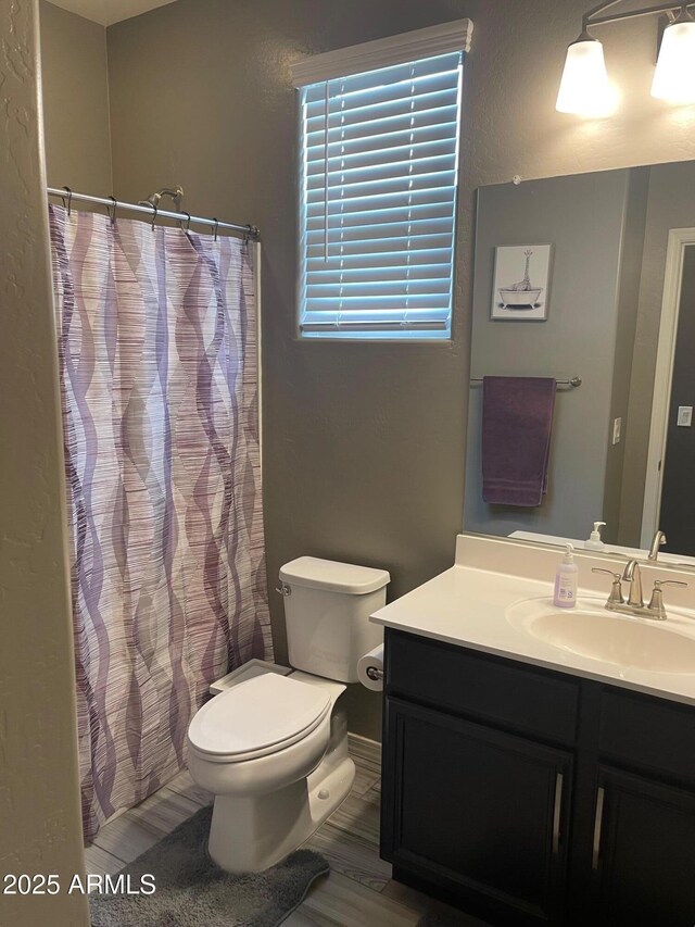 3211 W Pollack St, Phoenix, AZ 85041 - full bath with toilet, vanity, and curtained shower