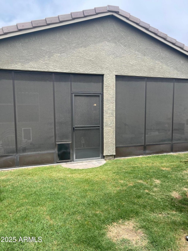 3211 W Pollack St, Phoenix, AZ 85041 - rear view of property with a lawn