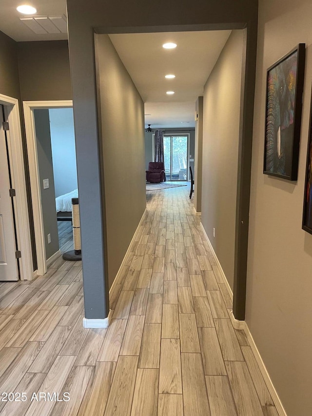 3211 W Pollack St, Phoenix, AZ 85041 - hall featuring light wood-style flooring, baseboards, and recessed lighting