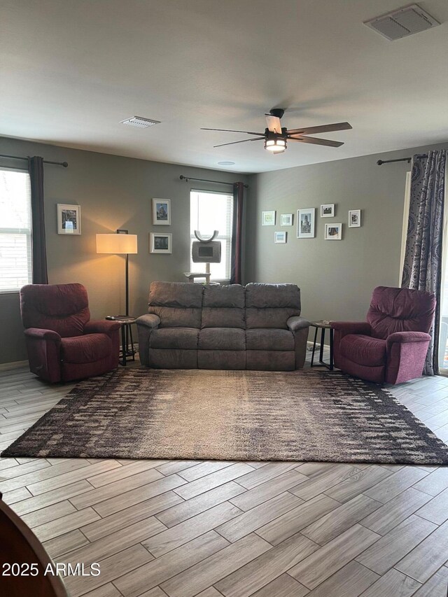 3211 W Pollack St, Phoenix, AZ 85041 - living room with a ceiling fan, healthy amount of natural light, and wood finished floors