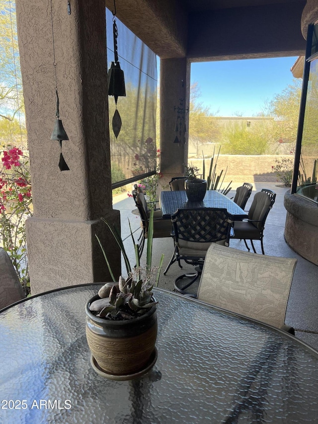 view of patio featuring outdoor dining area