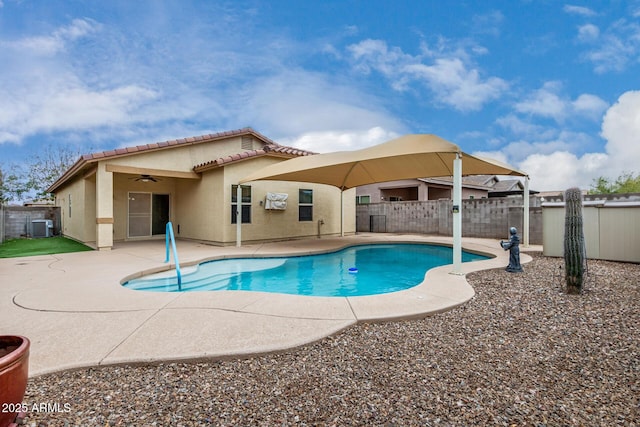 view of swimming pool featuring a fenced in pool, fence, central AC, and a patio area